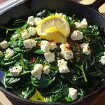Fresh sautéed spinach with feta in skillet